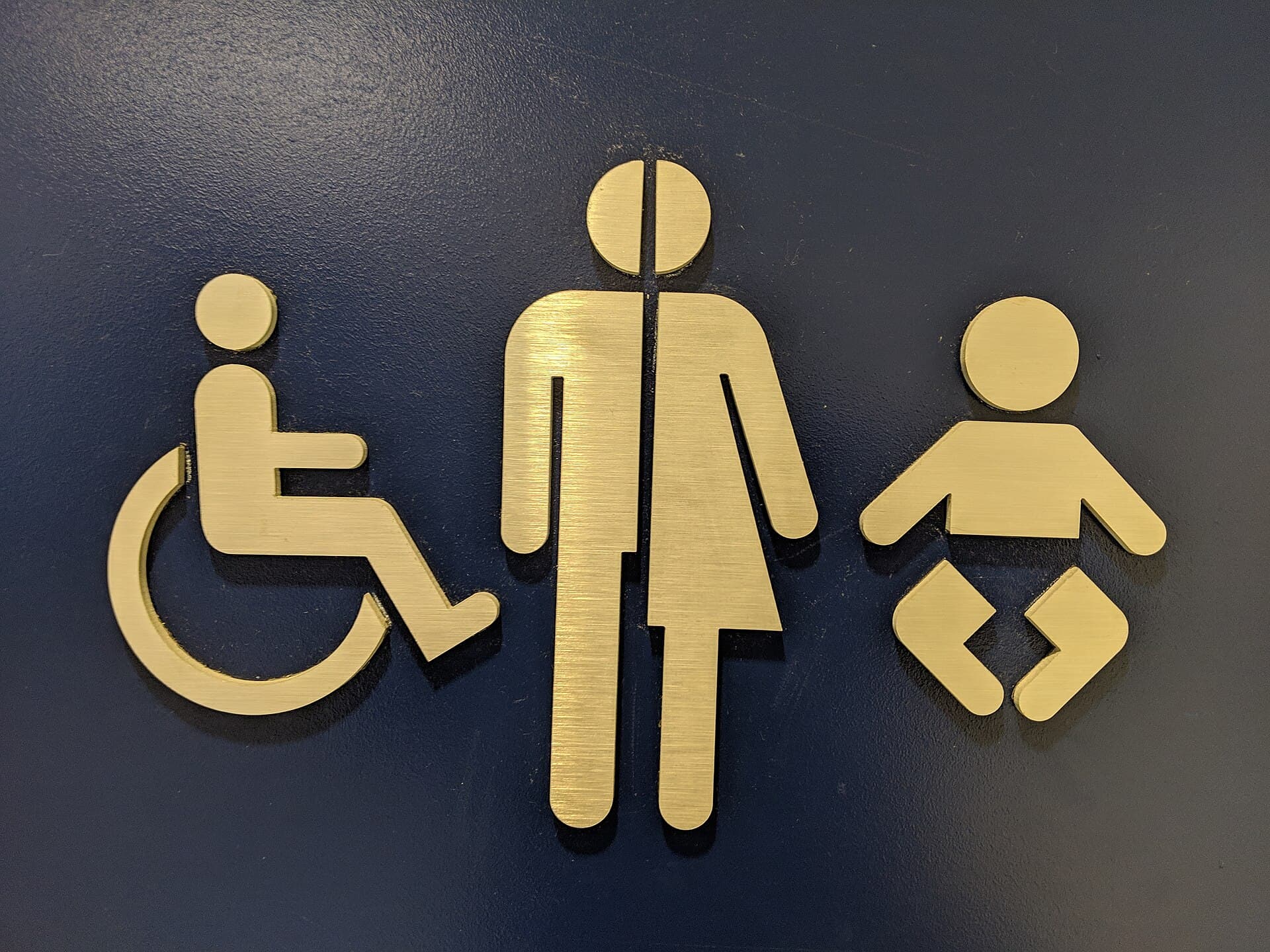 Inclusive bathroom glyphs, Halifax airport, Halifax, Nova Scotia, Canada
