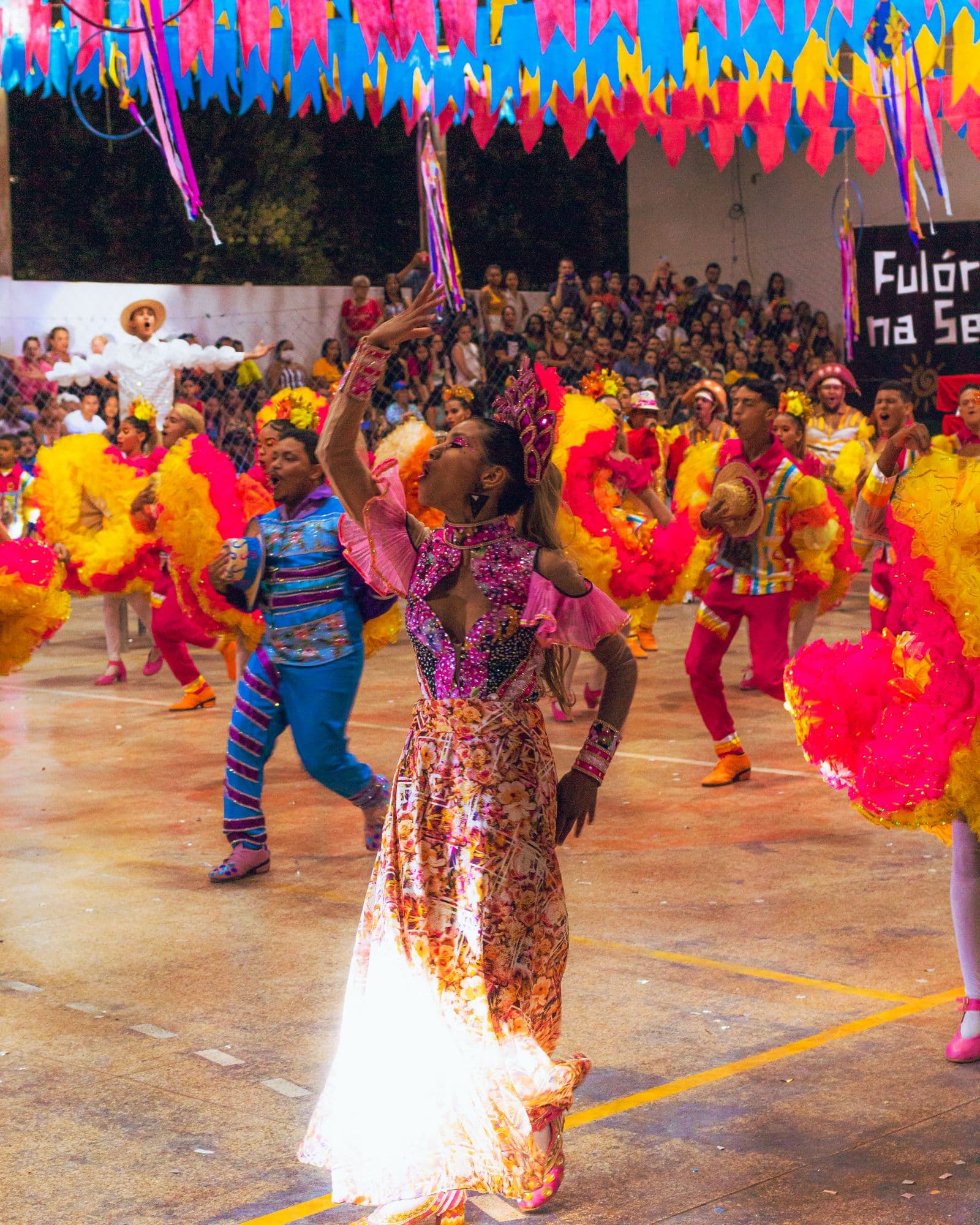 Colorful dancers performing at a Brazilian carnival celebration